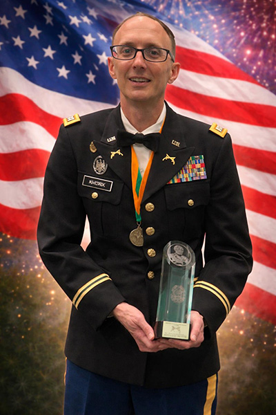 Captain Cody Khork receiving an award