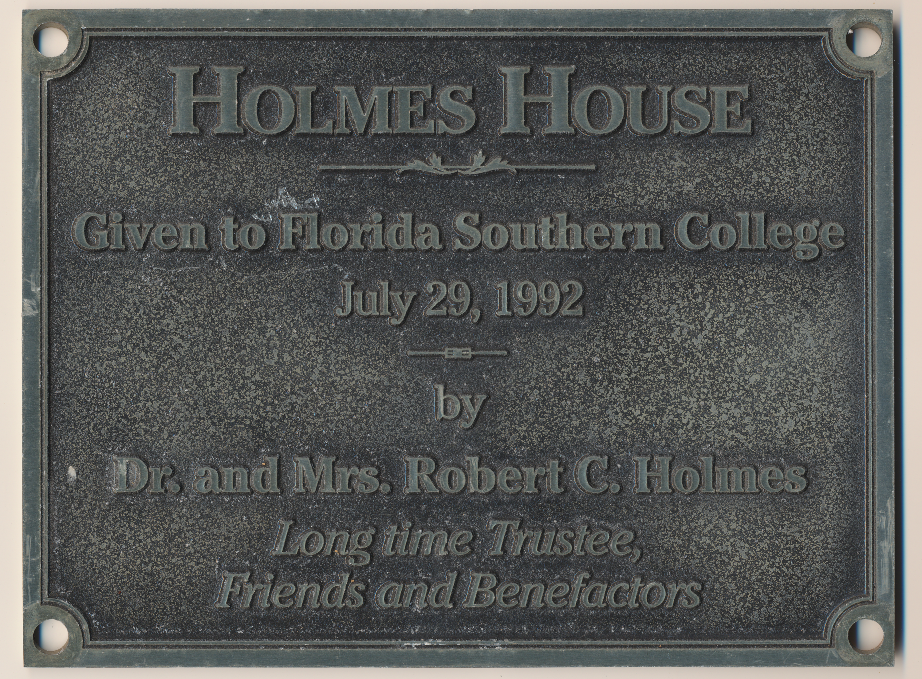 Holmes House. Given to Florida Southern College July 29, 1992. By Dr. and Mrs. Robert C. Holmes. Long time Trustee, Friends and Benefactors.