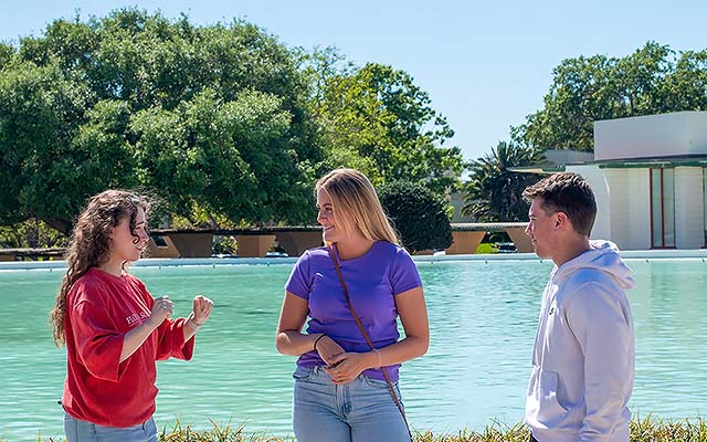 A group of students standing near the waterdome